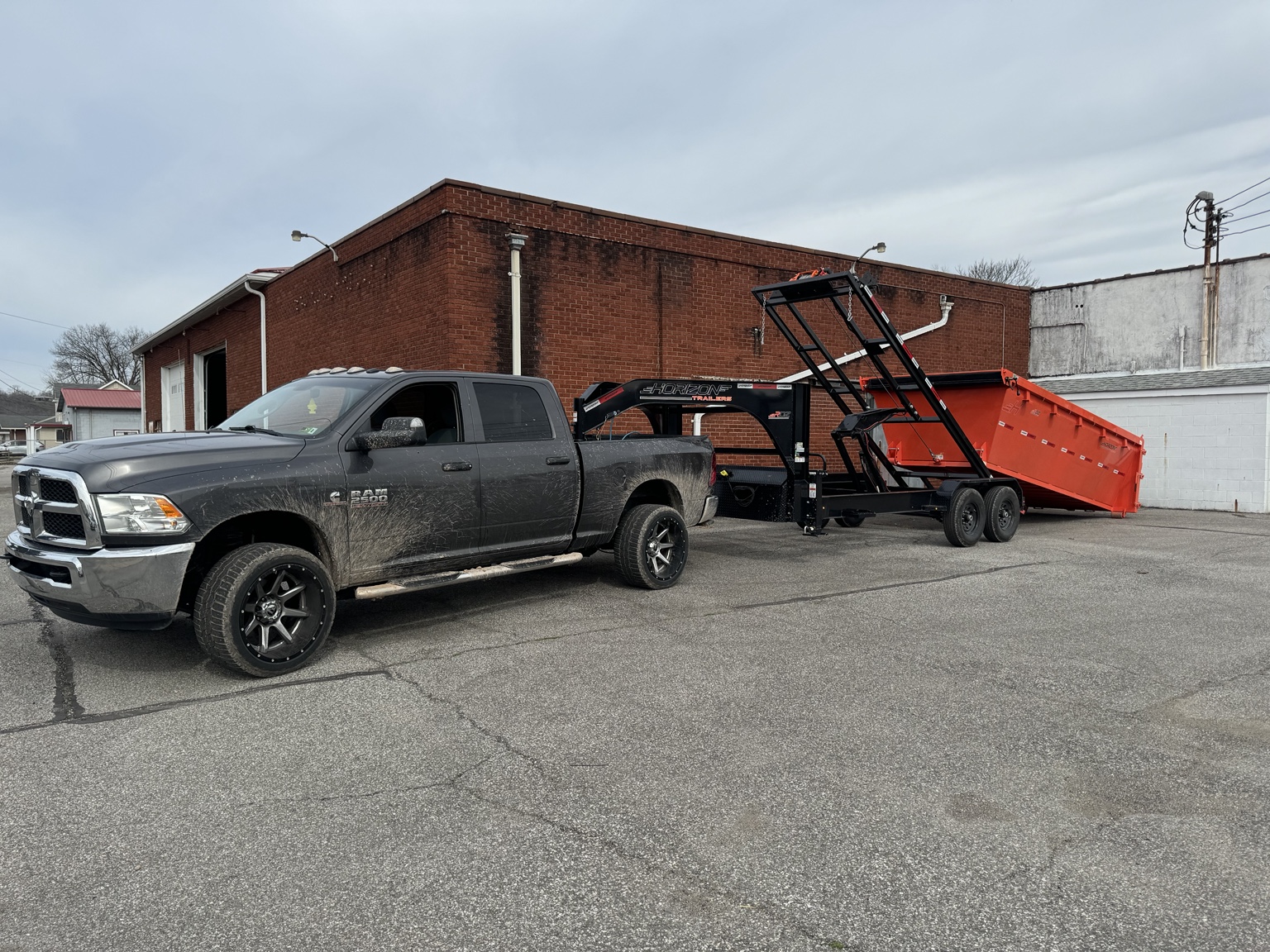 Triple G roll-off dumpster trailer and dumpster